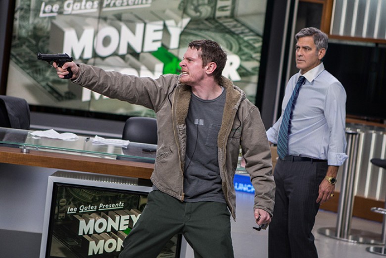 Kyle Budwell (Jack O’Connell) takes TV host Lee Gates (George Clooney) hostage in TriStar Pictures’ MONEY MONSTER. PHOTO BY: Atsushi Nishijima ©2016 CTMG, Inc. All rights reserved. **ALL IMAGES ARE PROPERTY OF SONY PICTURES ENTERTAINMENT INC. FOR PROMOTIO