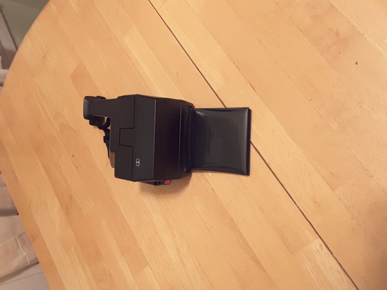 The Frog Tongue should roll out each time a photo is taken. The film needs to be protected in the first 5 milliseconds from exposure to light or your $3/shot will get ruined.