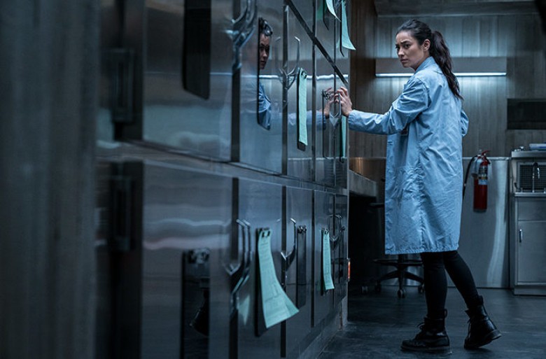 Megan (Shay Mitchell) realizes that something is not right in Hanna Grace’s cadaver drawer in Screen Gems’ THE POSSESSION OF HANNAH GRACE. PHOTO BY: Claire Folger. ©2018 CTMG, Inc. All Rights Reserved. **ALL IMAGES ARE PROPERTY OF SONY PICTURES ENTERTAINM