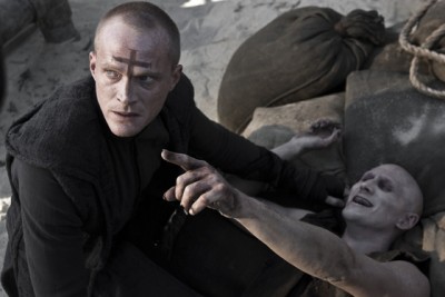 Priest (Paul Bettany, left) finishes off Familiar #1 (Josh Wingate)