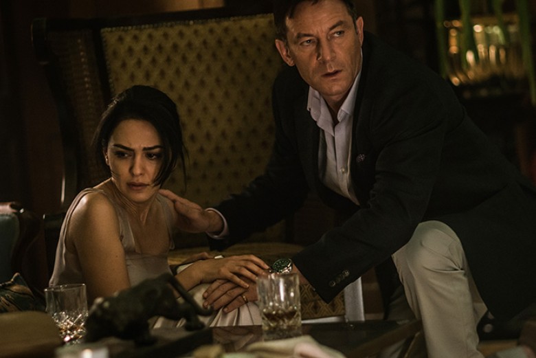 Nazanin Boniadi (left) as ’Zahra’ and Jason Isaacs (right) as ’Vasili’ in director Anthony Maras’ HOTEL MUMBAI, a Bleecker Street release.