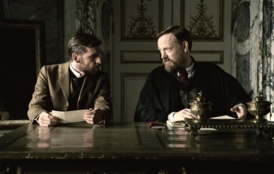 PAUL ANDERSON as Colonel Sebastian Moran and JARED HARRIS as Dr. James Moriarty
