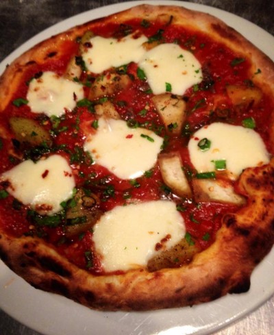 Spicy eggplant pizza with capers, anchovies, and fresh mozzarella.  