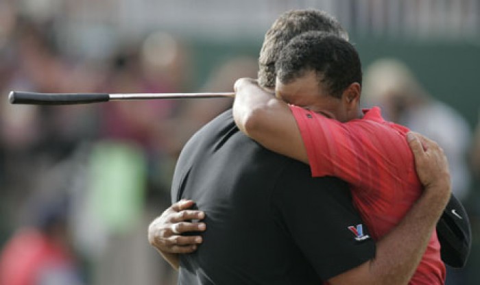 Tiger Woods emotionally embracing caddy Steve Williams after his victory in 2006