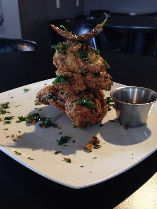 Herb dressed fried chicken with chile infused honey and garlic mustard mashed potatoes